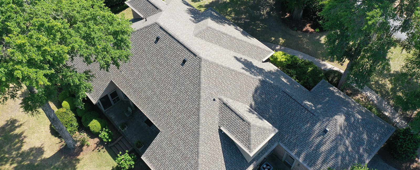 Top view of a home with gray shingles that Tabor Homes & Exteriors worked on it